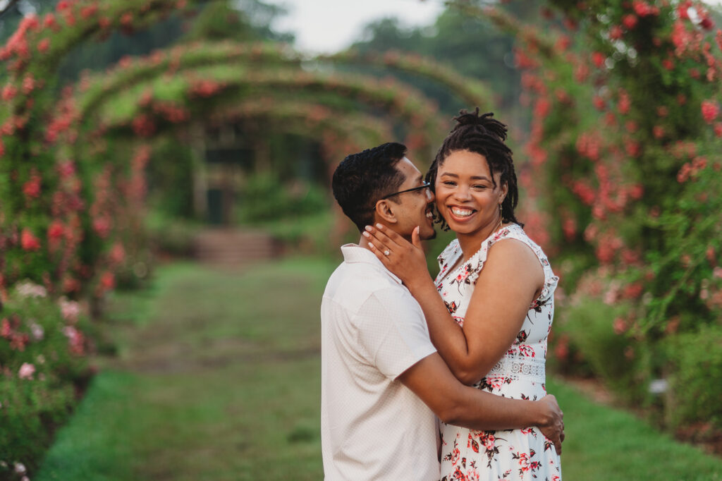couple poses at Elizabeth Park for engagement photos