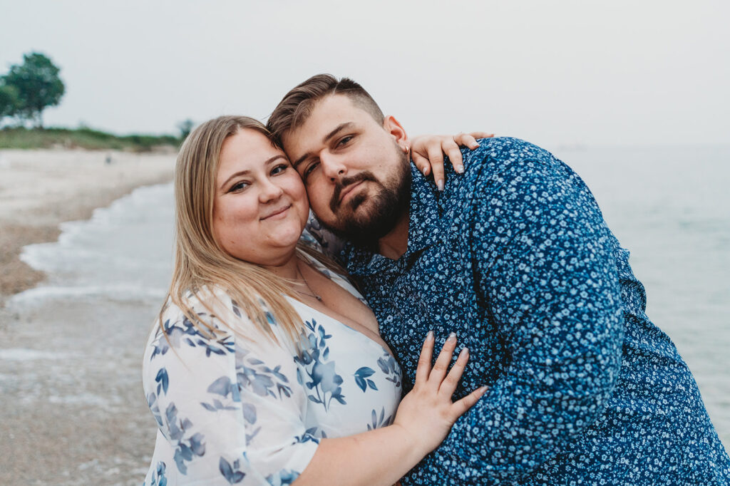 Couple at the beach for their engagement photos