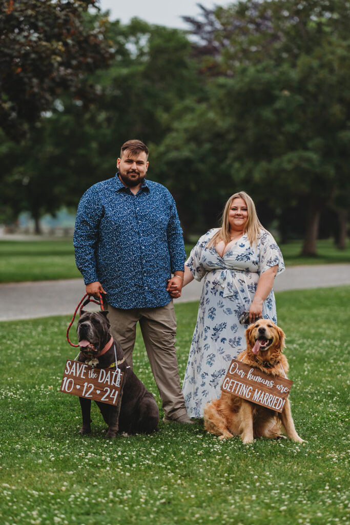 Happy couple with their dog in an outdoor location