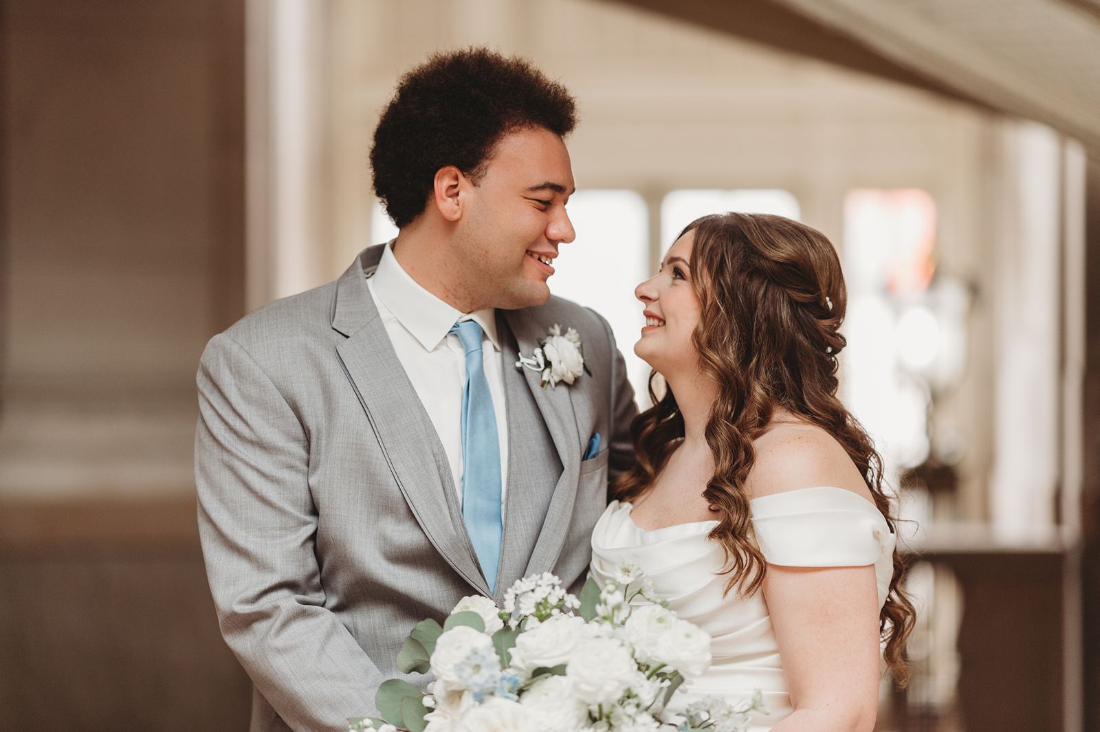 A Bride and Groom looking at each other for a portrait at Hartford City Hall Hall Wedding