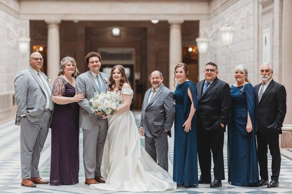 Group wedding photo taken inside Hartford City Hall