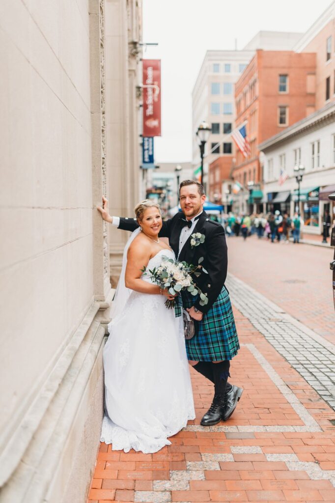 bride and groom posed outside the Society Room wedding venue in Hartford, CT