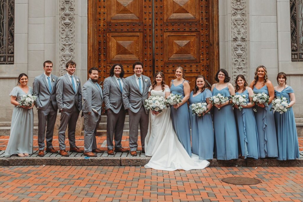 wedding party posed outside of The Society Room of Hartford wedding venue