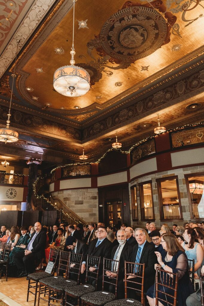 Guests seated for indoor wedding at The Society Room of Hartford