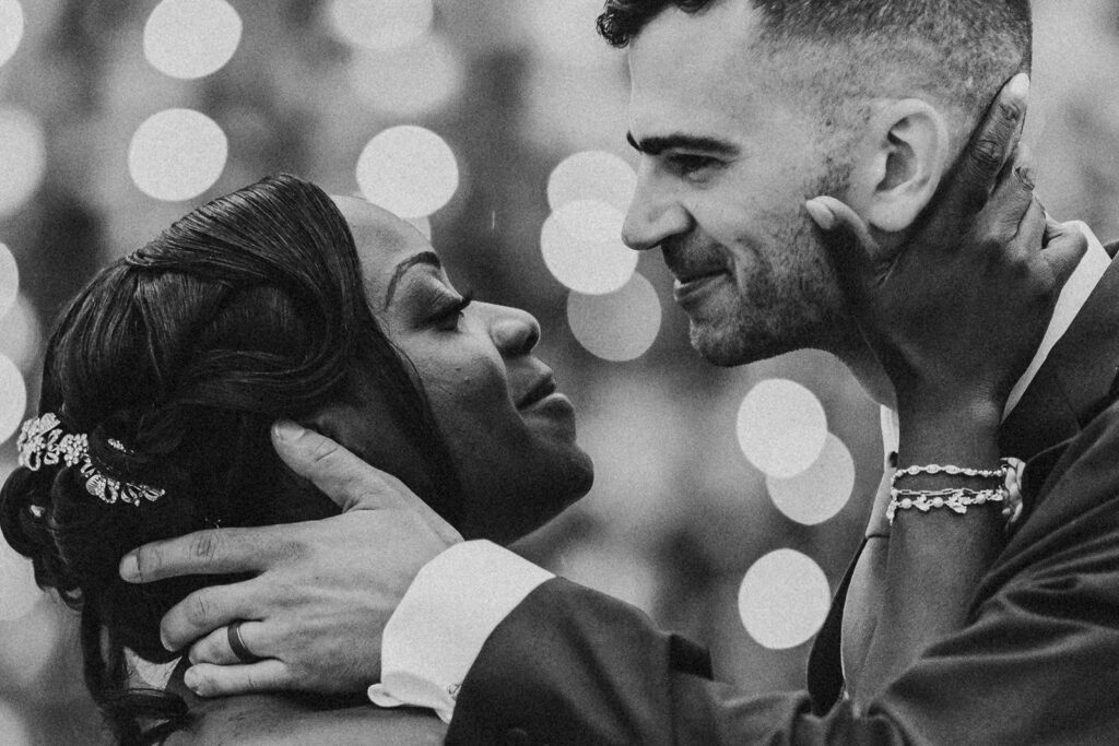 Bride and groom smiling joyfully on their wedding day.