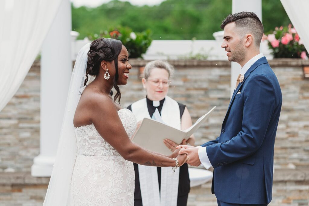 Bride and groom exchanging heartfelt wedding vows during the ceremony space at La Bella Vista.
