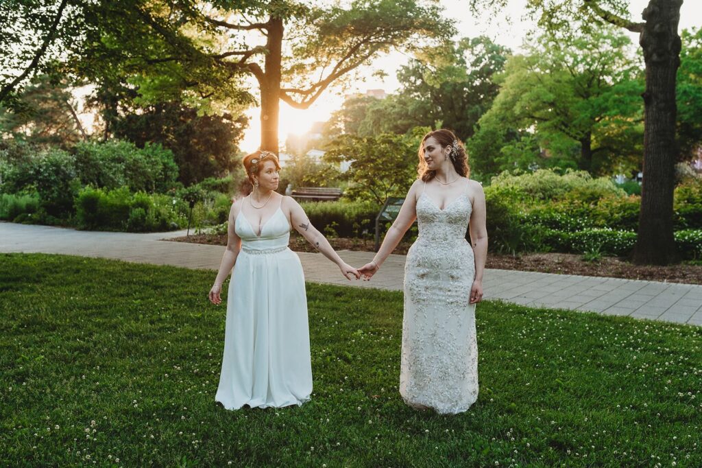 a sunset photo of the two lovely brides