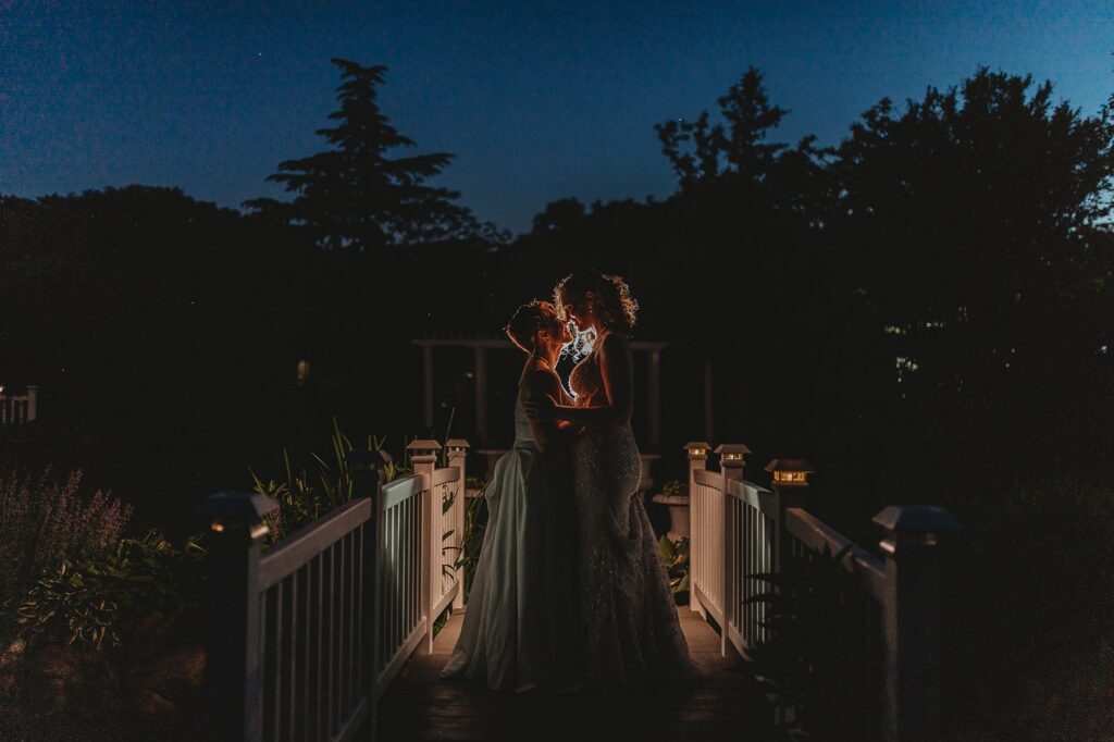 An off camera flash night portrait with the dramatic night sky at Queens Botanical Garden
